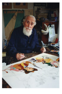 Al Hirschfeld sitting in his studio working on a one of his drawings. 